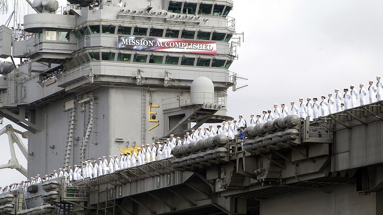 mission accomplished banner on uss abraham lincoln