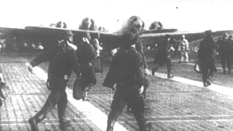 Japanese fighter pilots on deck of aircraft carrier, just prior to Pearl Harbor attack