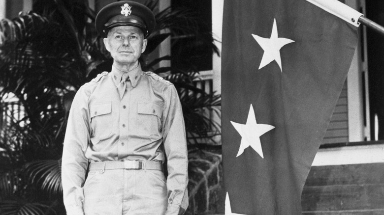 Lt. General Walter C. Short standing uniform flag