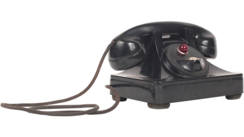 Vintage black phone on white background