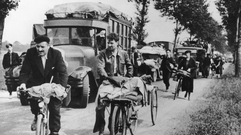refugees evacuating paris on rural road 1940