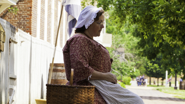 woman dressed as colonial era reenactor
