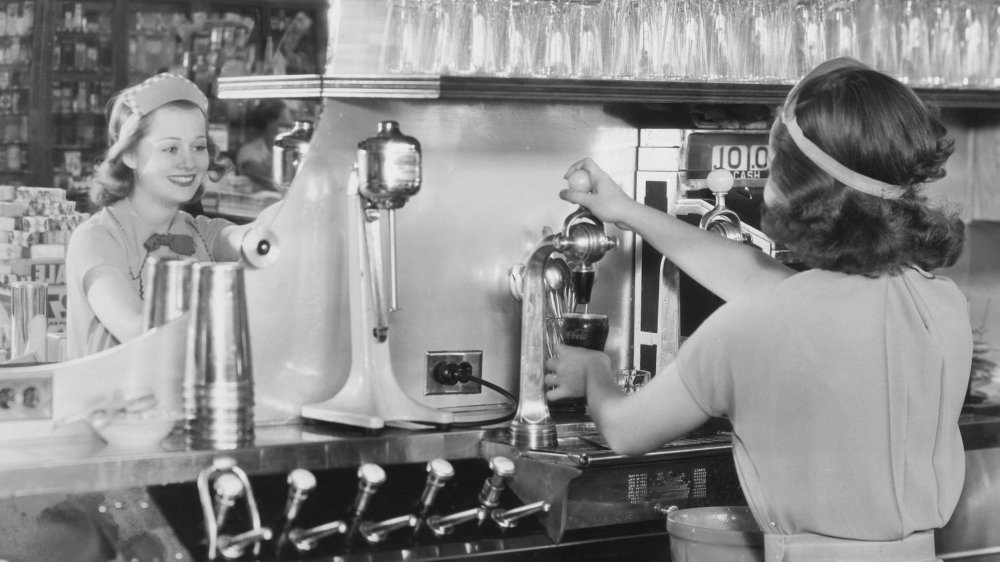 Soda jerks at a soda fountain