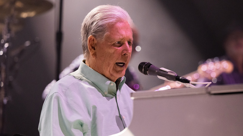 Brian Wilson performing at the piano