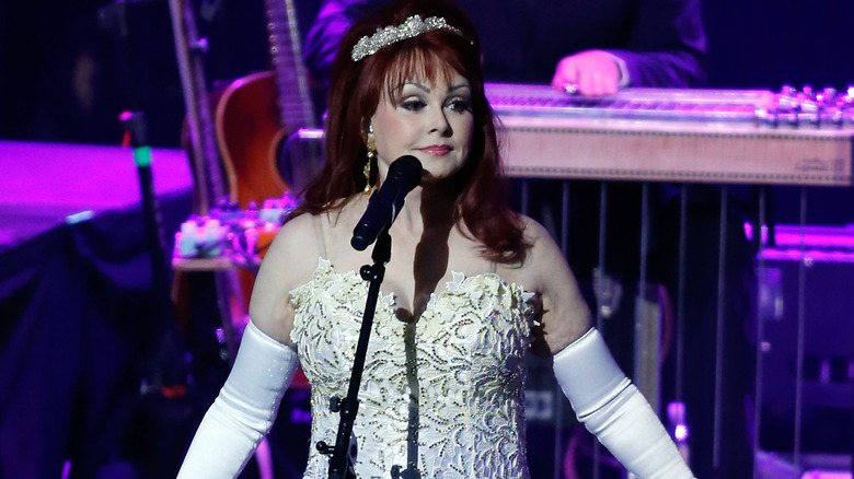 Naomi Judd performing on stage