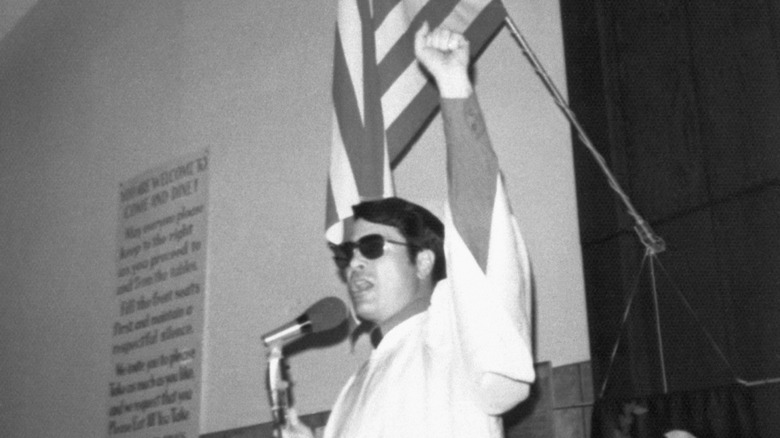 Jim Jones preaching with fist raised