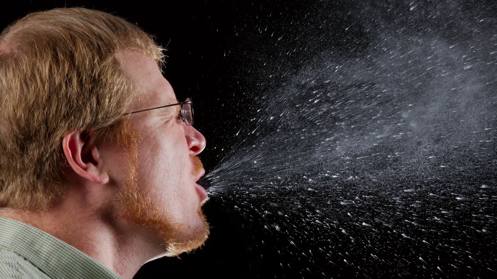 man sneezing