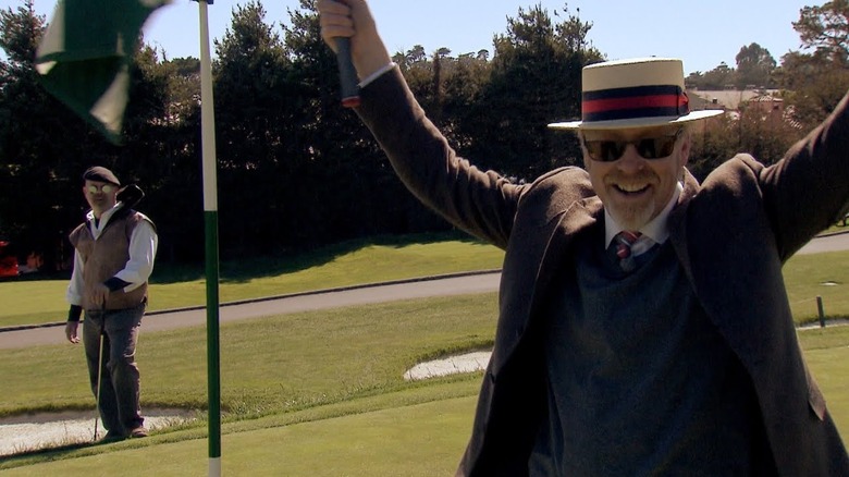 Screenshot of Adam Savage celebrating mid-golf game