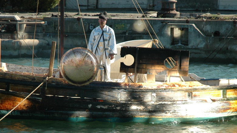 Screenshot of Jamie standing in mock boat during Archimedes death ray test