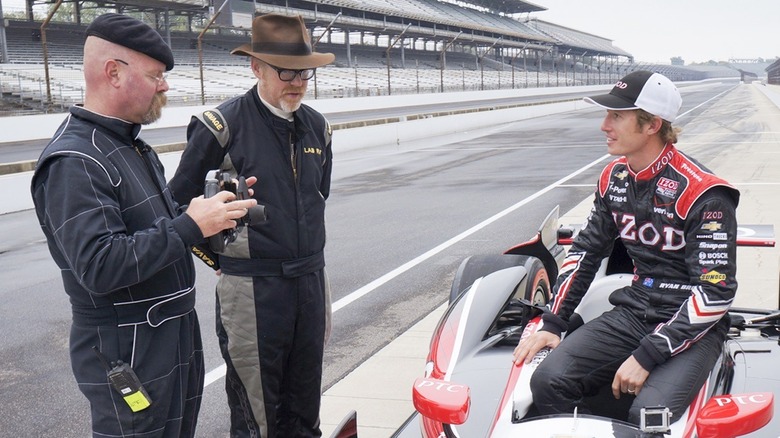 Adam and Jamie speaking to Indy Car driver on track screenshot