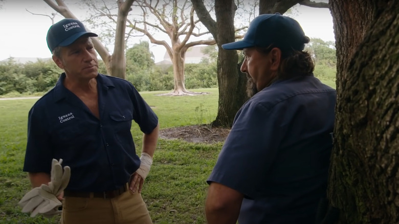 Mike Rowe talks with an iguana wrangler