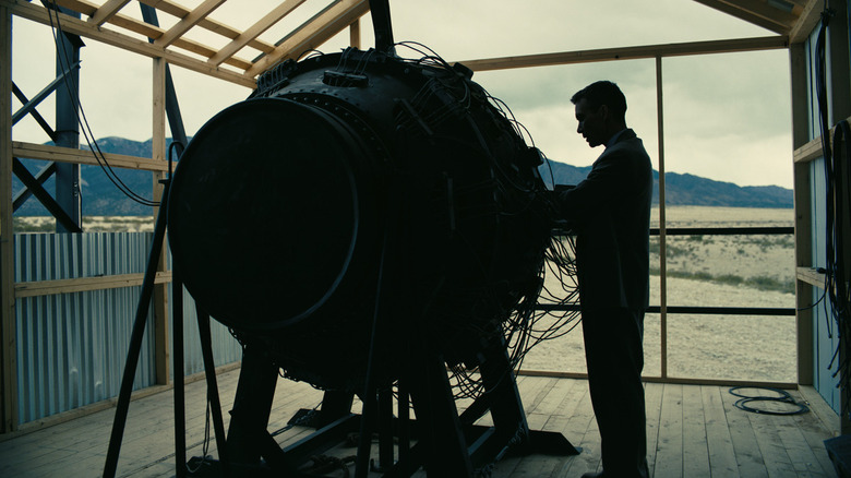 Oppenheimer touching bomb