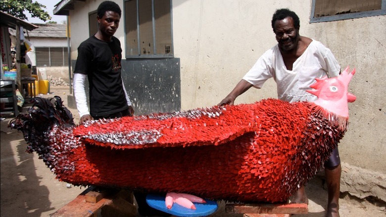 two men coffin shaped like rooster