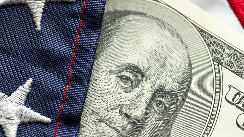 dollar behind american flag