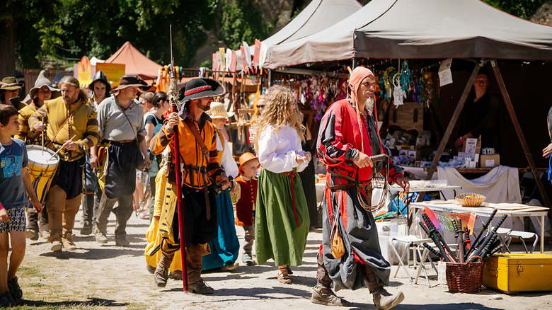 Renaissance fair people walking market