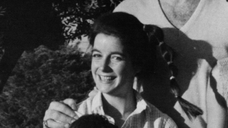 dominique dunne smiling with ponytail outdoors