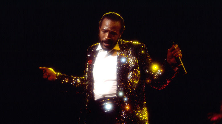 marvin gaye resplendent in sequins on stage with mic