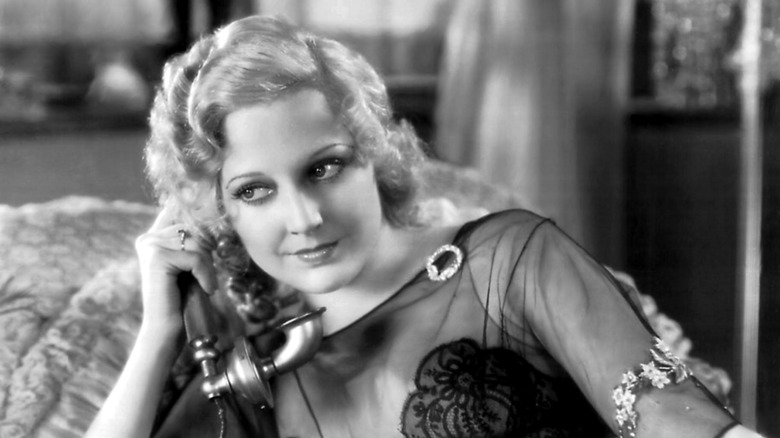 thelma todd sat holding vintage telephone in film still