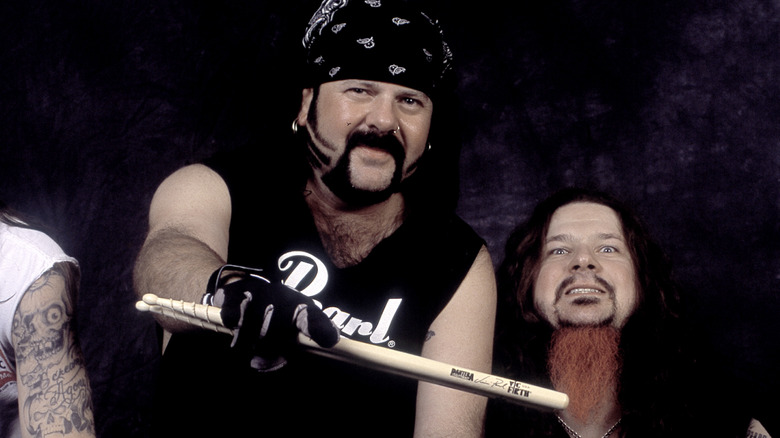 Vinnie Paul and Dimebag Darrell posing for a picture together in 1997