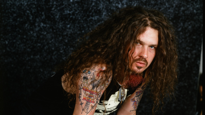 Dimebag Darrell hunched over for a photo in Tokyo, Japan in 1992