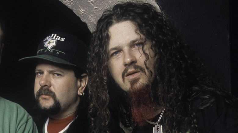 Vinnie Paul and Dimebag Darrell posing for a photo backstage in 1993