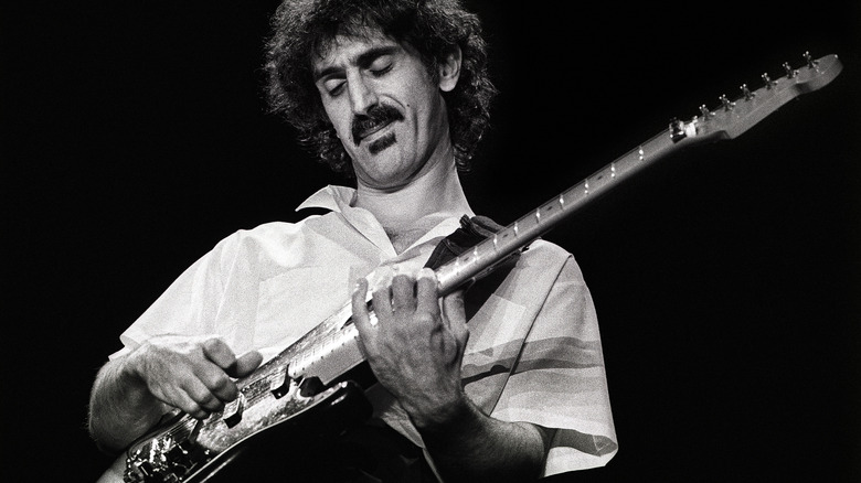 Frank Zappa playing the guitar