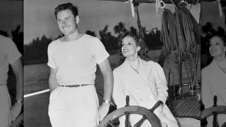 Errol Flynn and Lili Damita pose on boat