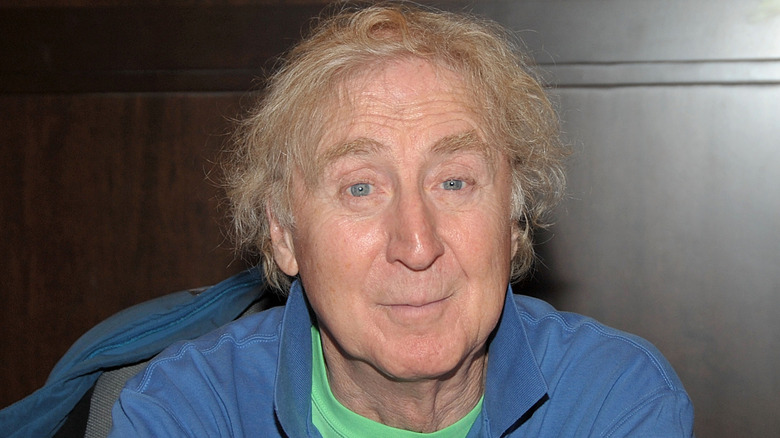 Gene Wilder smiling in blue shirt