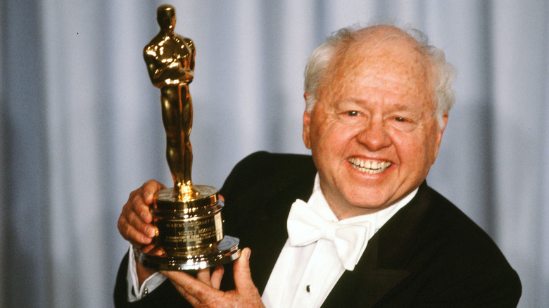 Mickey Rooney holds up an Oscar