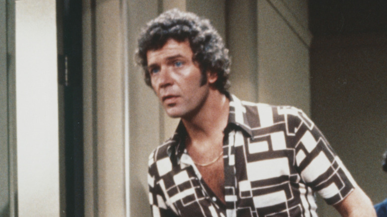 Robert Reed leans forward