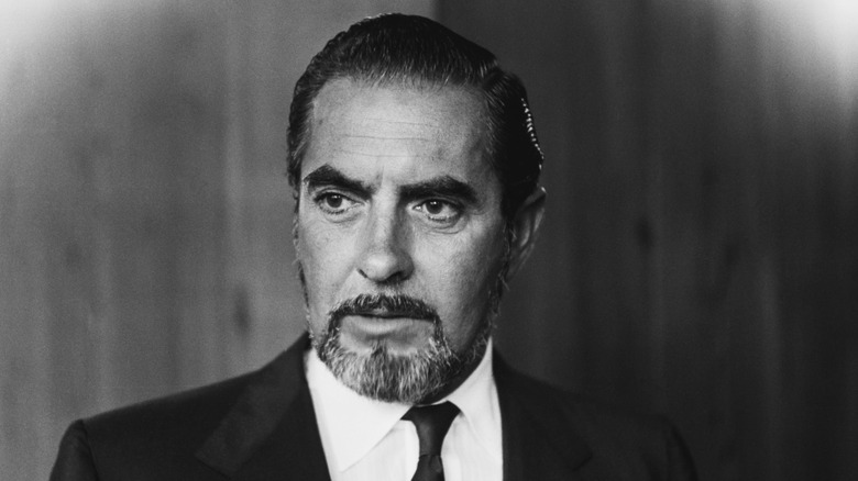 Tyrone Power looking stern with goatee in suit