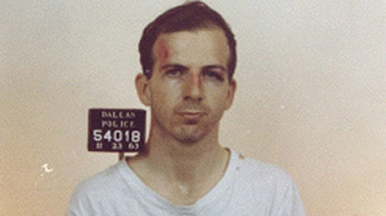 Lee Harvey Oswald color mug shot with film