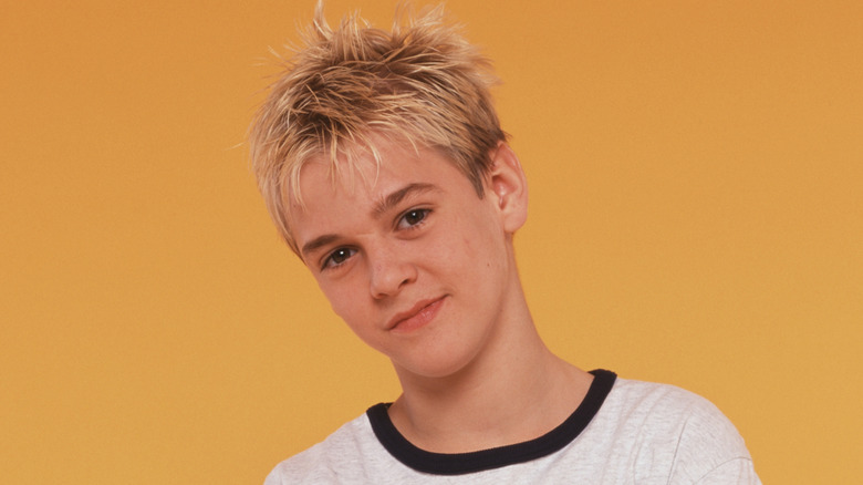 Aaron Carter smirking in t-shirt in 2000 promo photo