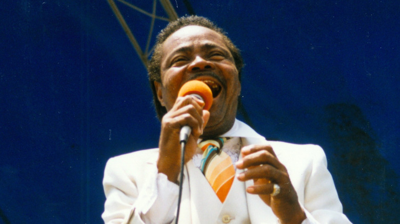Ernie K-Doe singing in white suit at New Orleans Jazz Fest