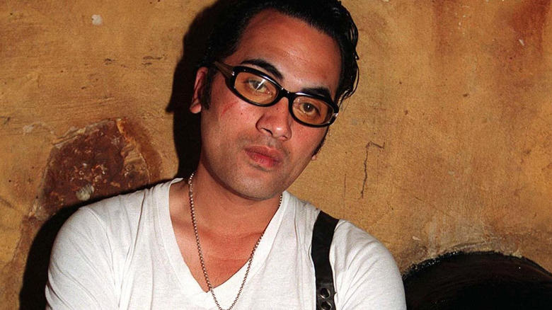 Pauly Fuemana of OMC wearing glasses and tilting head