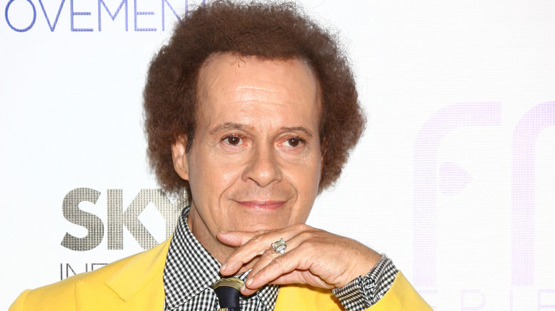 Richard Simmons resting head on hand