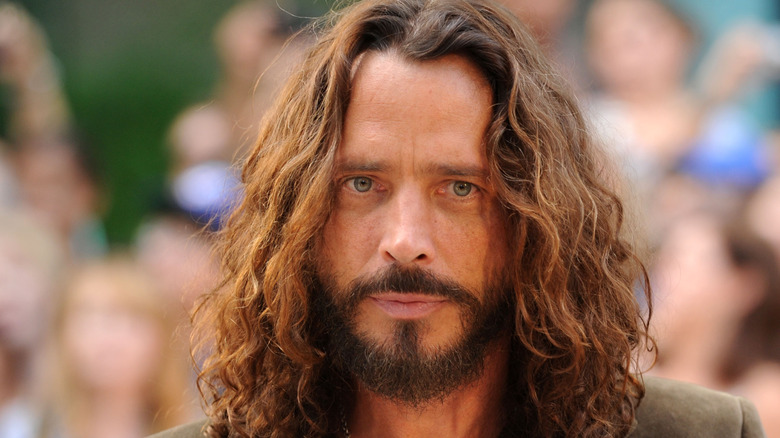 Chris Cornell wearing blazer staring into camera