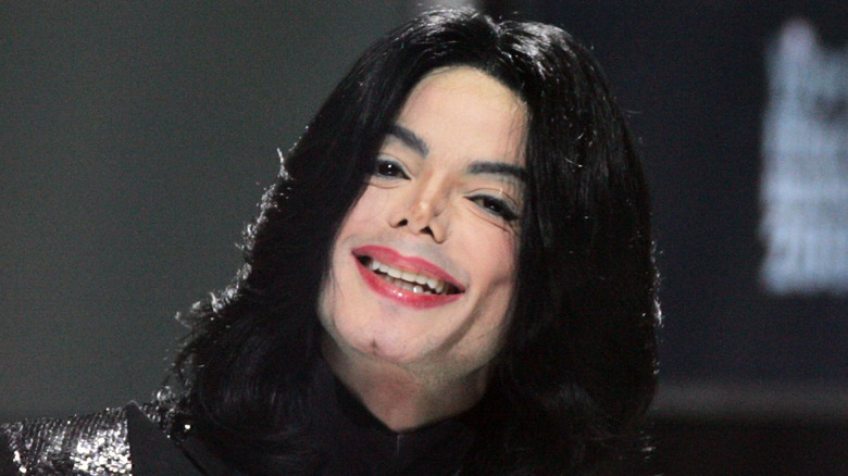 Michael Jackson laughing with tilted head