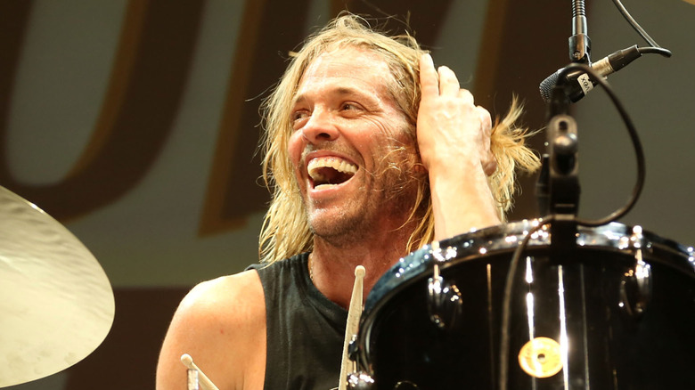 Taylor Hawkins smiling behind drum kit