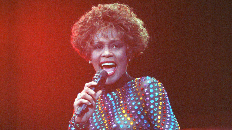 Whitney Houston singing on stage in 1991