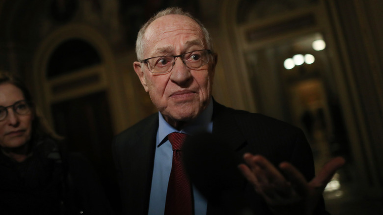 Alan Dershowitz in a darkened room
