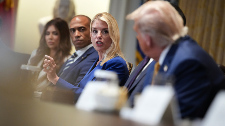 Pam Bondi in a meeting at a table with others including Donald Trump