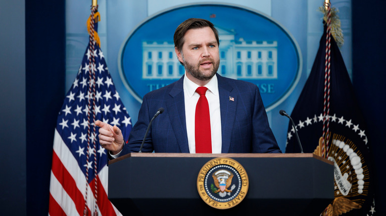 JD Vance speaking at a press conference at the White House