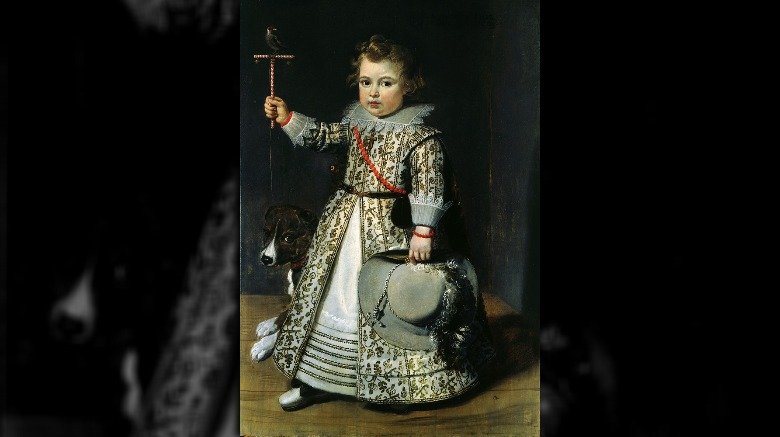 young boy wearing dress