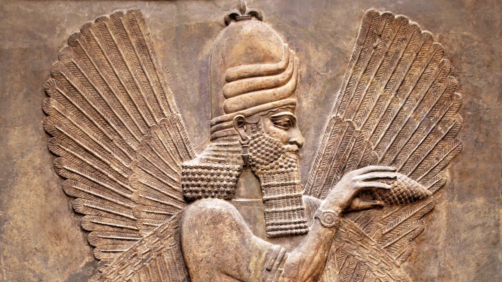 WInged figure in Mesopotamian wall carving
