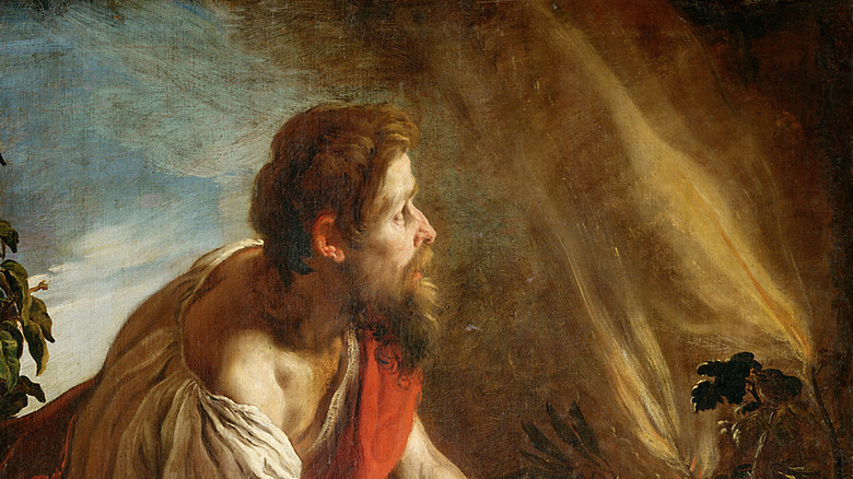 Moses cowering before the burning bush