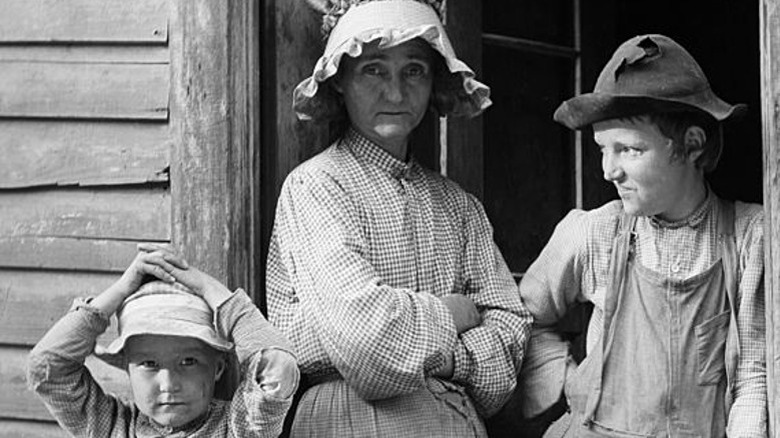 Ozark family standing in a doorway