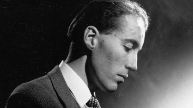 Christopher Lee bows his head