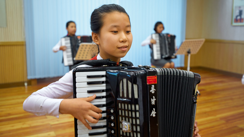 North Korean children learning the accordion
