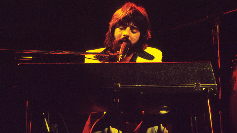 Michael McDonald singing and playing keys on stage